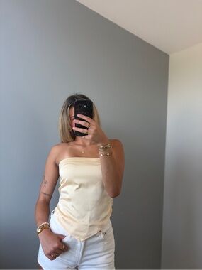 These three satin strapless yellow top